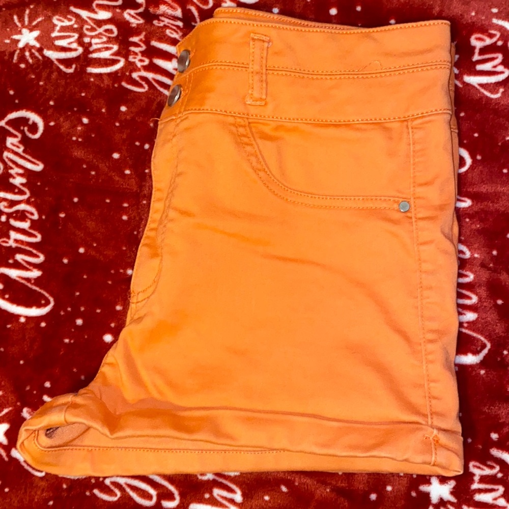 They appear orange but are a bit more peachy in person. Used